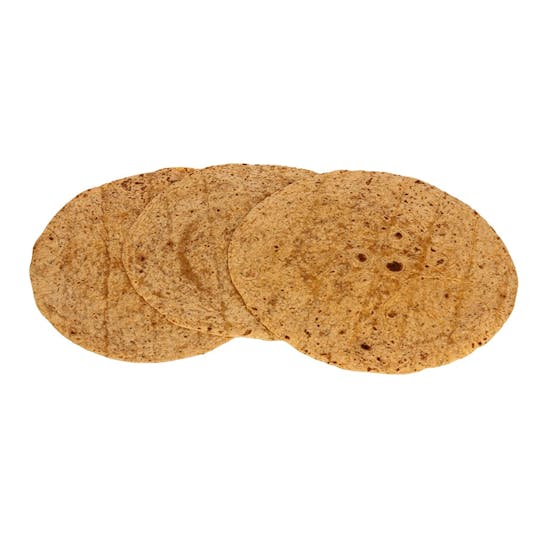 Three whole wheat tortillas are arranged in a slight overlapping row on a white background. The tortillas are round, thin, and have a speckled brown appearance.