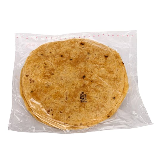 A stack of round, golden-brown tortillas in a clear plastic packaging, sealed and labeled, set against a plain white background.