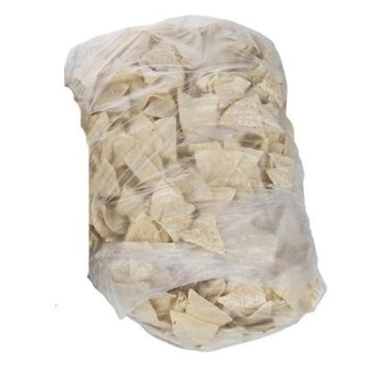 A large clear plastic bag filled with tortilla chips, sealed and showing the chips stacked inside. The background is plain white.