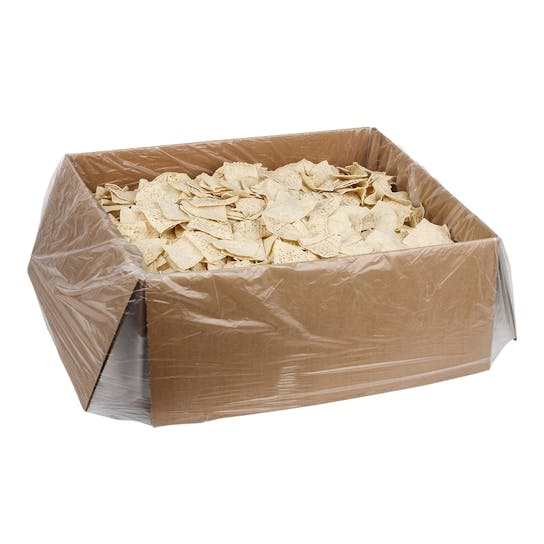 A large open cardboard box lined with clear plastic, filled with a bulk quantity of tortilla chips.