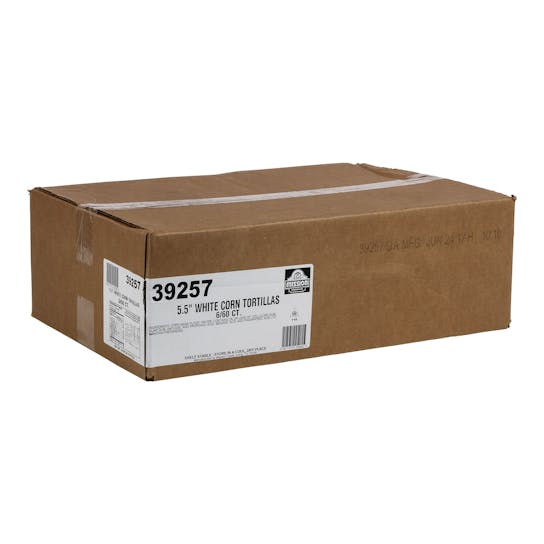 A large brown cardboard box labeled 5.5 White Corn Tortillas 6/60 ct. sits on a white background. The label includes the product number 39257 and distribution information.