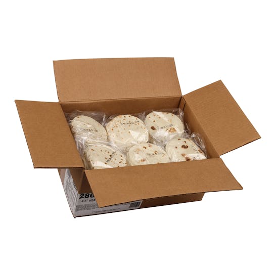 An open cardboard box containing several stacks of round flour tortillas, each stack wrapped in clear plastic.
