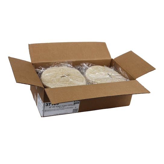 An open cardboard box containing several stacks of flour tortillas wrapped in clear plastic. The tortillas are round and light beige in color. The box is on a white background.